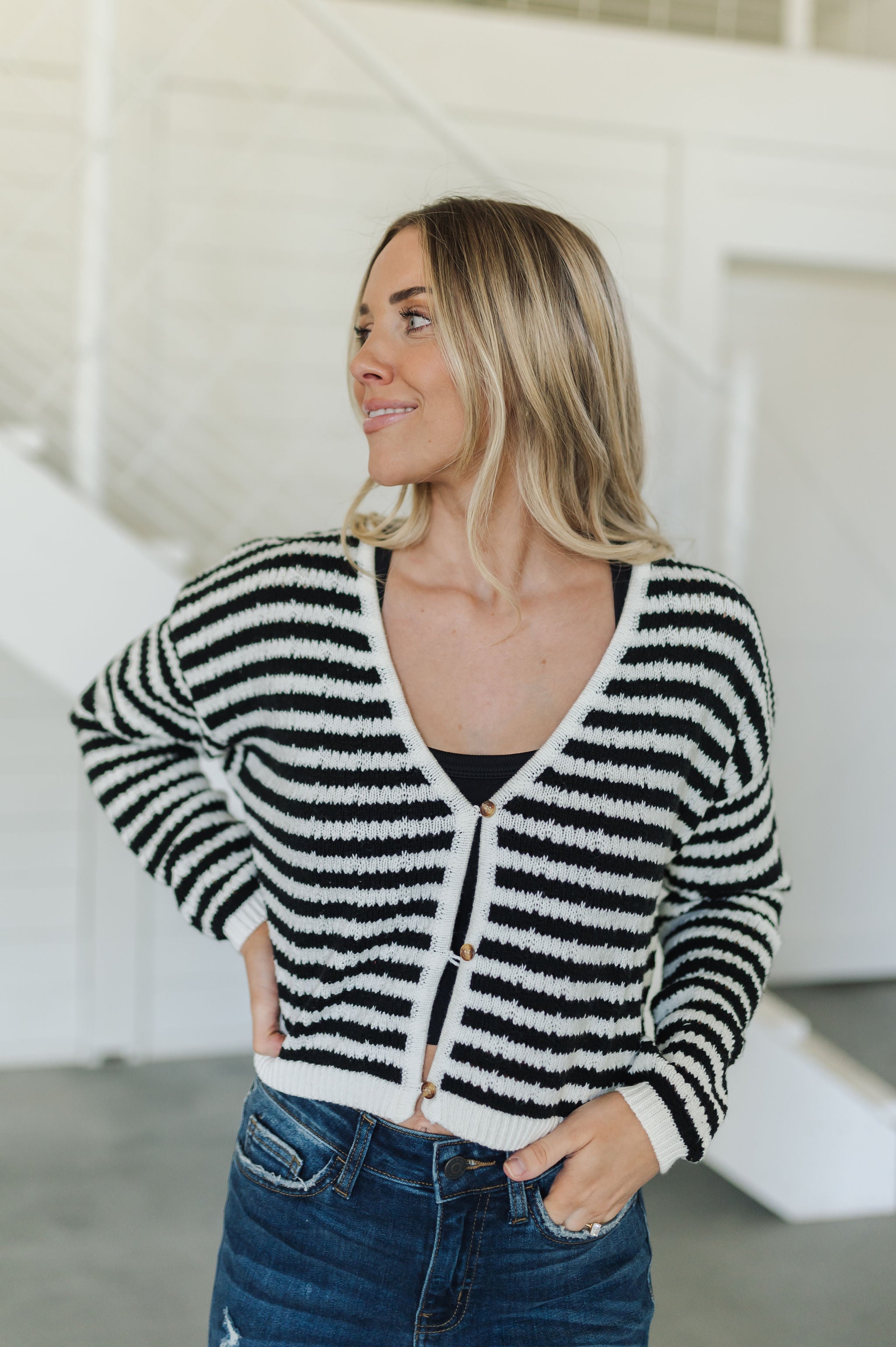 Front view of  Beverly Crochet Knitted Cardigan with button front and black and white stripes. 