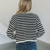 Rear view of  Beverly Crochet Knitted Cardigan with black and white stripes. 
