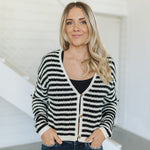 Front view of  Beverly Crochet Knitted Cardigan with button front and black and white stripes. 