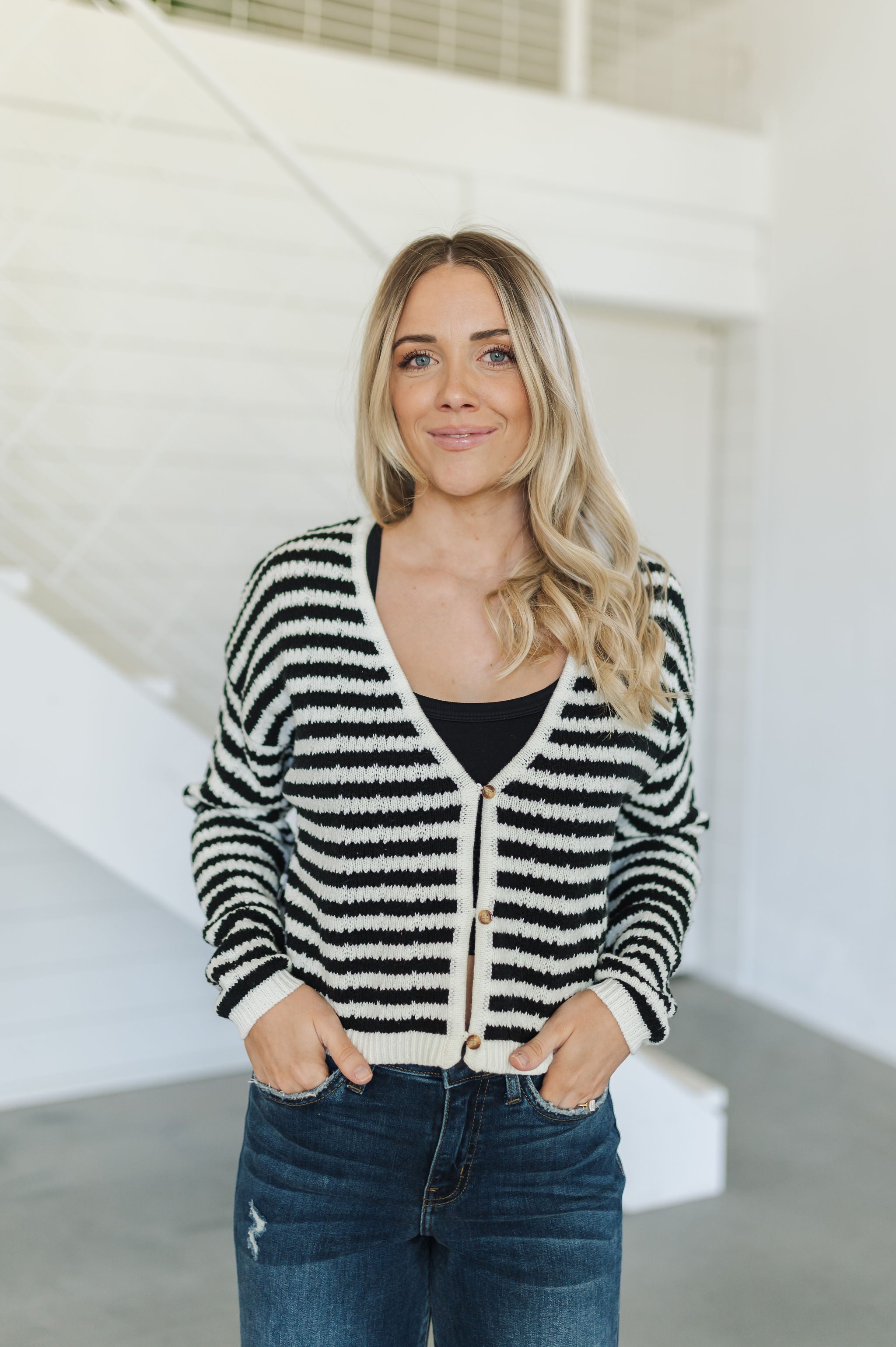 Front view of  Beverly Crochet Knitted Cardigan with button front and black and white stripes. 