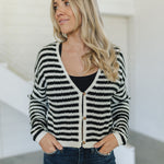 Front view of  Beverly Crochet Knitted Cardigan with button front and black and white stripes. 