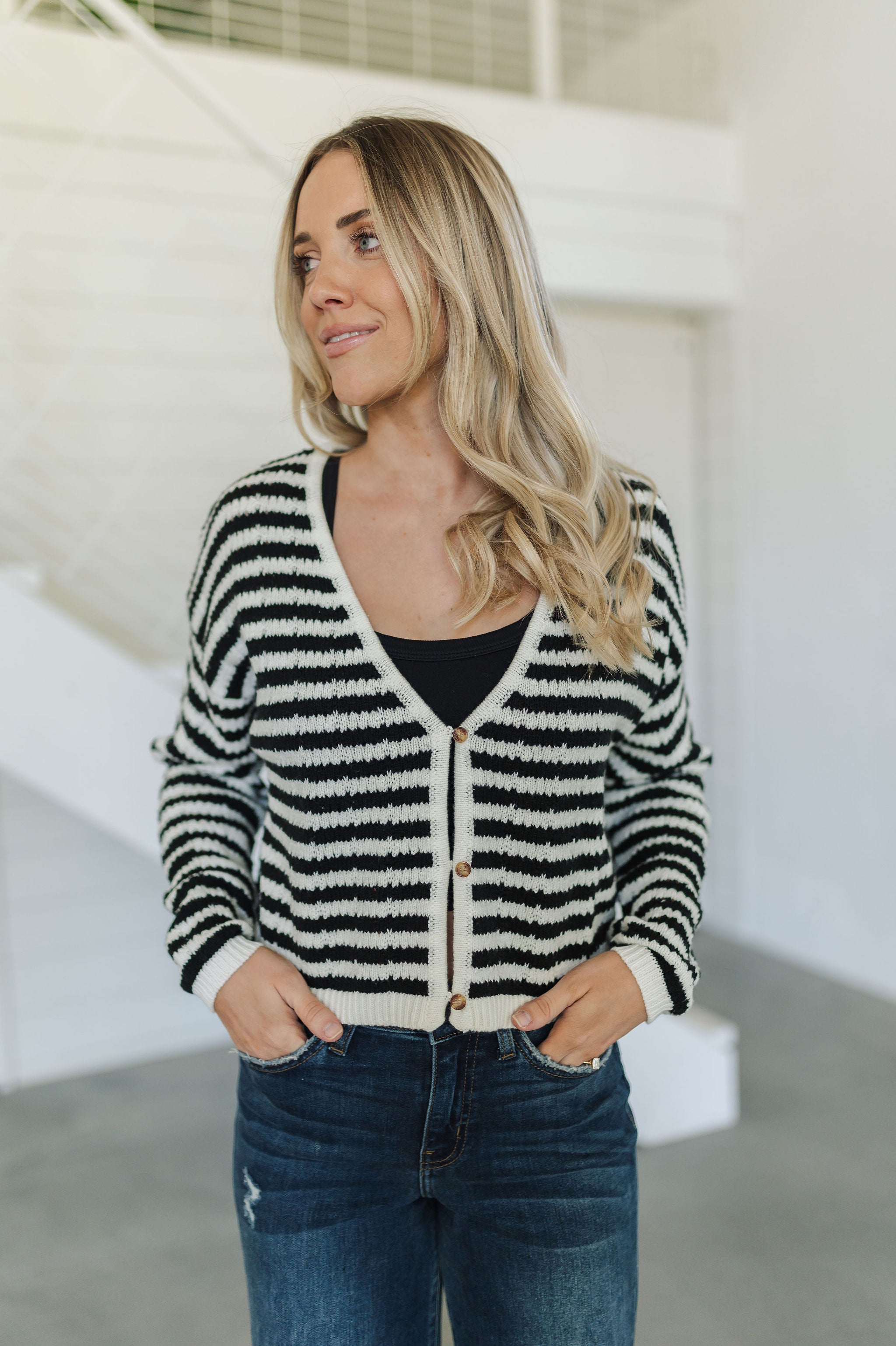 Front view of  Beverly Crochet Knitted Cardigan with button front and black and white stripes. 