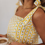 Up close view of Britt Bow PJ Set with adjustable tie straps and limoncello print.