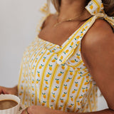 Up close view of Britt Bow PJ Set with adjustable tie straps and limoncello print.