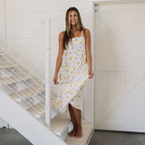 Front view of Summer Fling Midi Dress with embroidered Limoncello print, thin straps, square neckline, and ruffled hem. 