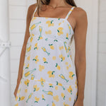 Front view of Summer Fling Midi Dress with embroidered Limoncello print, thin straps, and square neckline.