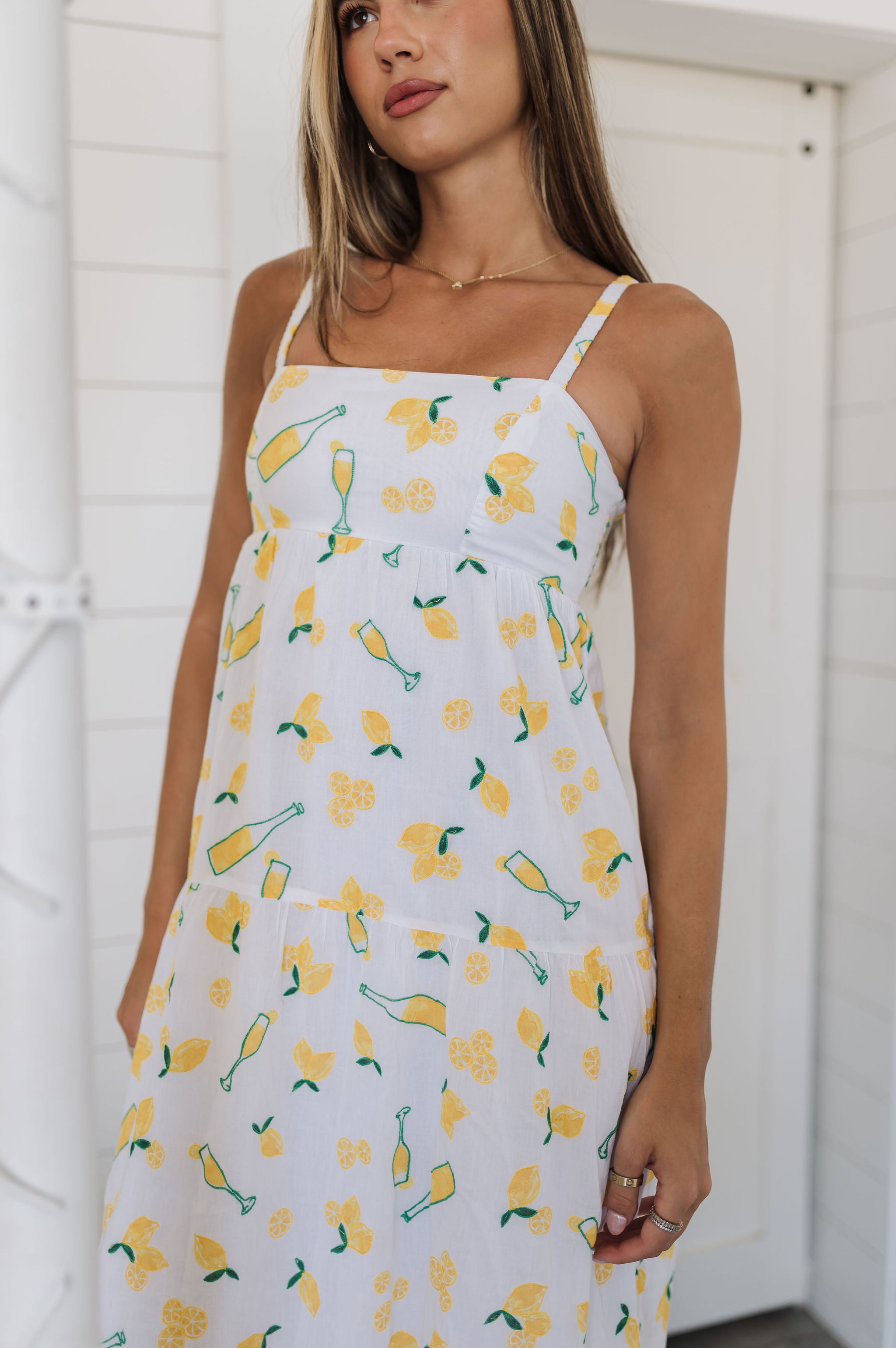 Front view of Summer Fling Midi Dress with embroidered Limoncello print, thin straps, and square neckline.