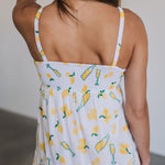 Rear view of Summer Fling Midi Dress with embroidered Limoncello print, thin straps, and smocked back.