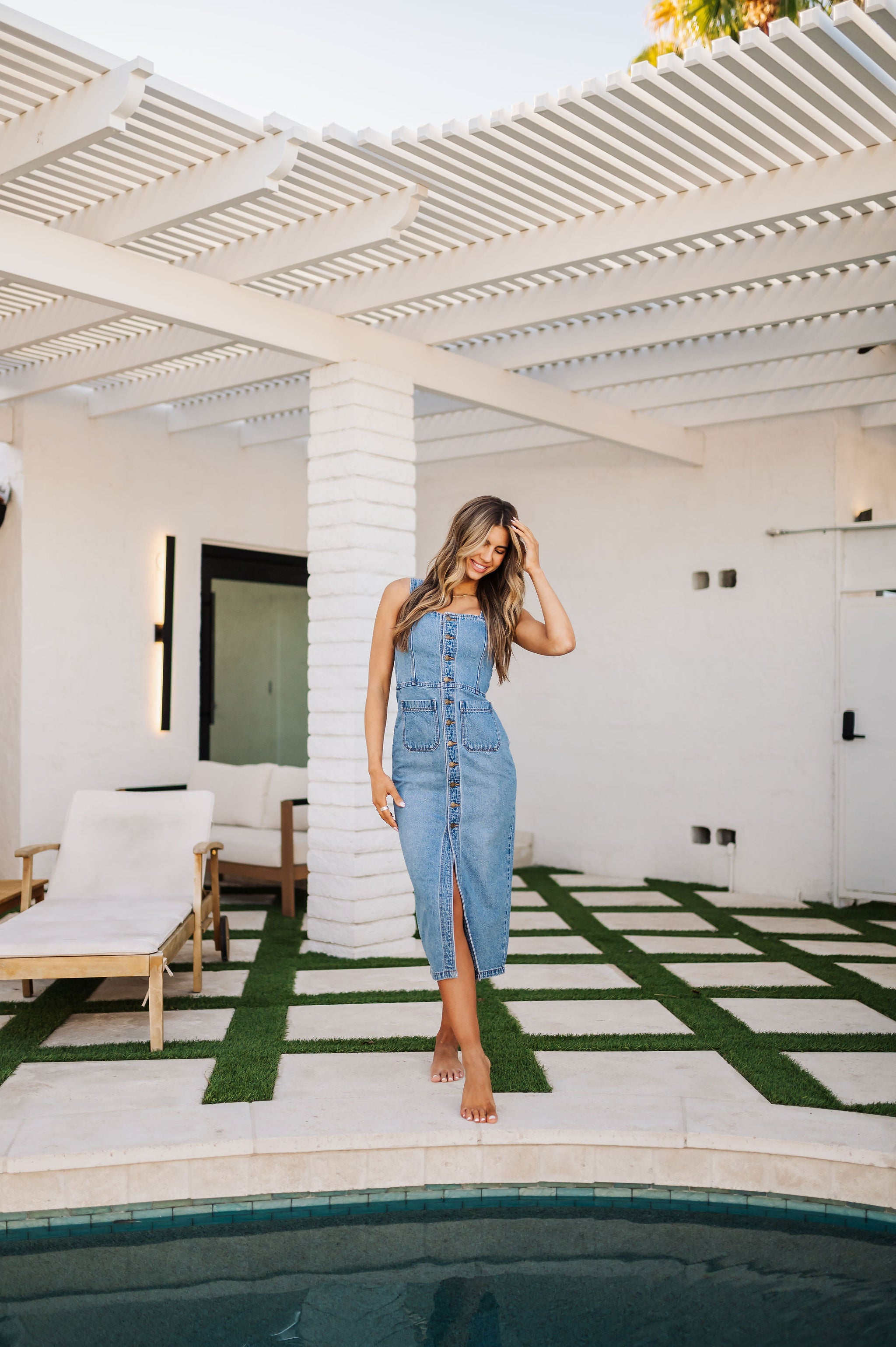 Front view of button up Sailor Dress with square front pockets and front slit.