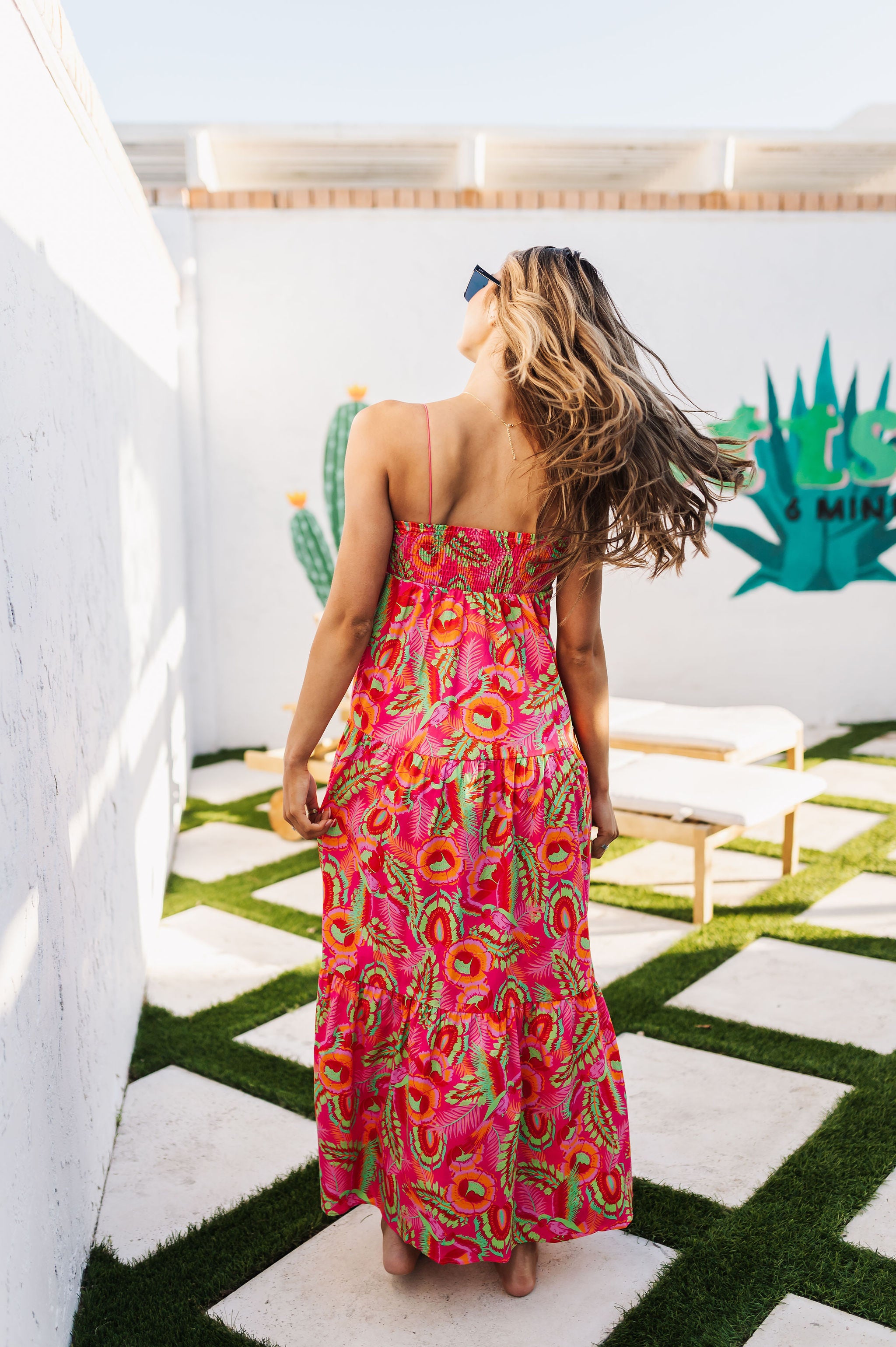 Rear view of Long Weekend Maxi Dress with allover neon print and slim shoulder straps. 