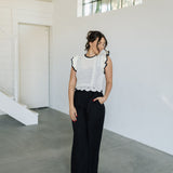 Front view of Chloe Pleat Linen Pant in black with relaxed leg and side pocket. 