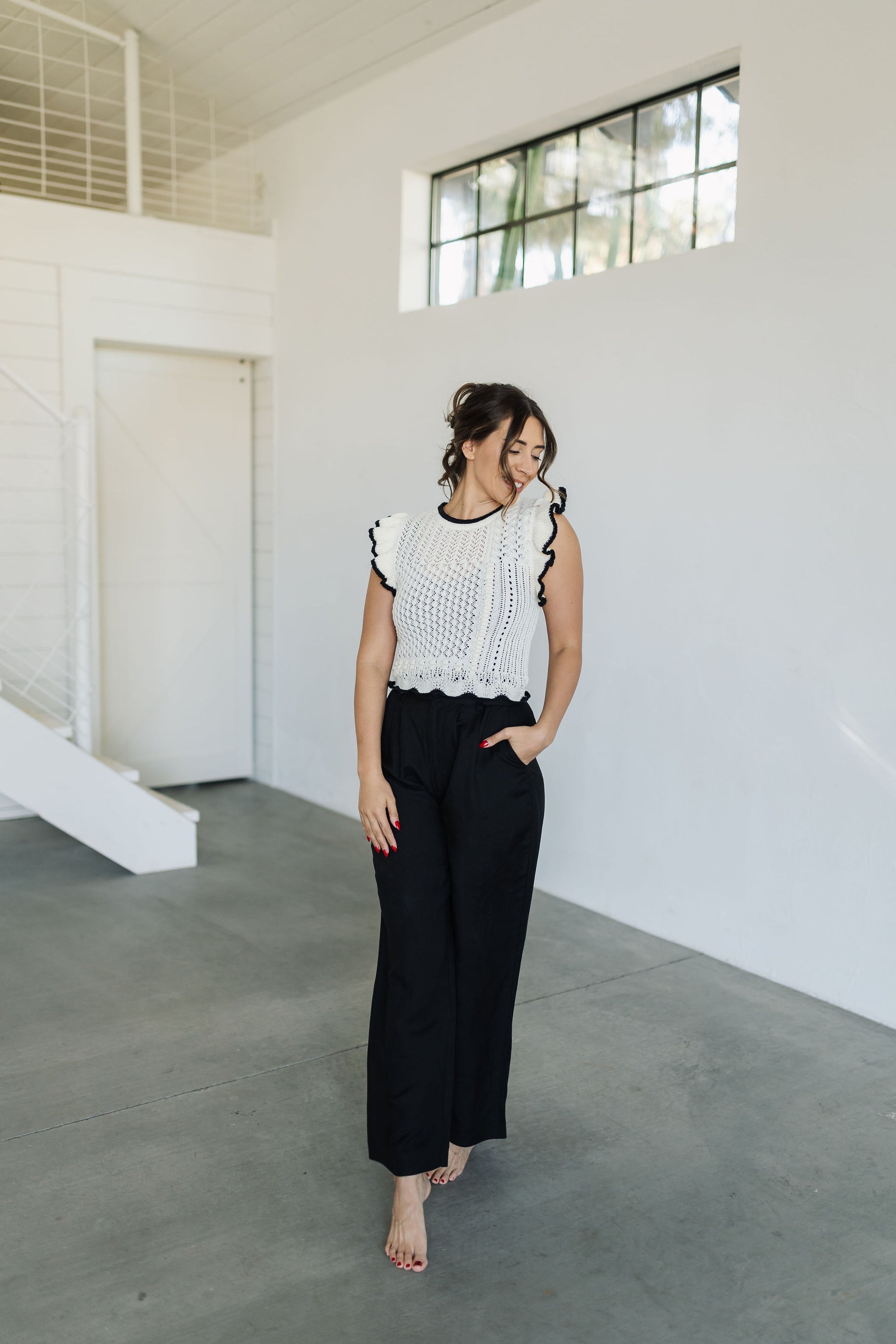 Front view of Chloe Pleat Linen Pant in black with relaxed leg and side pocket. 