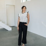 Front view of Chloe Pleat Linen Pant in black with relaxed leg and side pocket. 