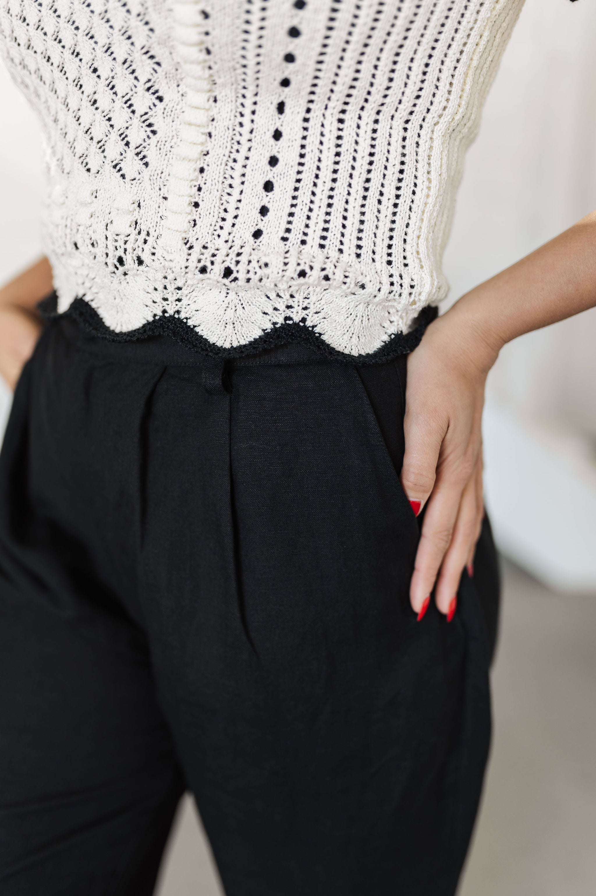 Up close view of Chloe Pleat Linen Pant in black with pleat front detail and side pocket.  