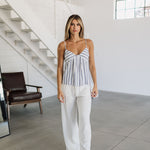 Front view of Nautical Striped Tank Top with V-neck, blue stripes, and spaghetti straps. 