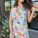 Front view of sleeveless Reno Romper in allover floral print, zip up front, and collared neckline. 