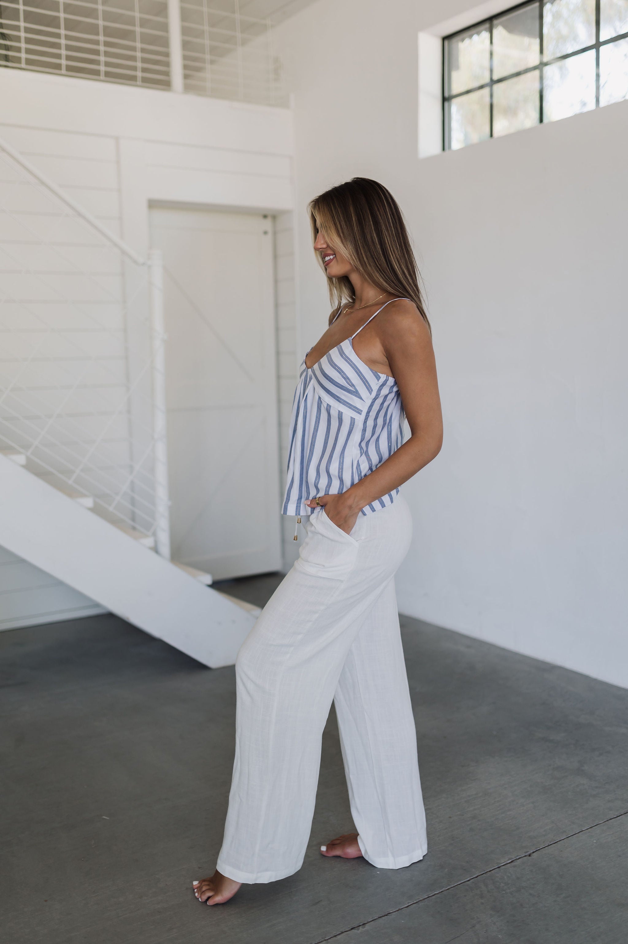 Side view of Nautical Striped Tank Top with V-neck, blue stripes, and spaghetti straps. 