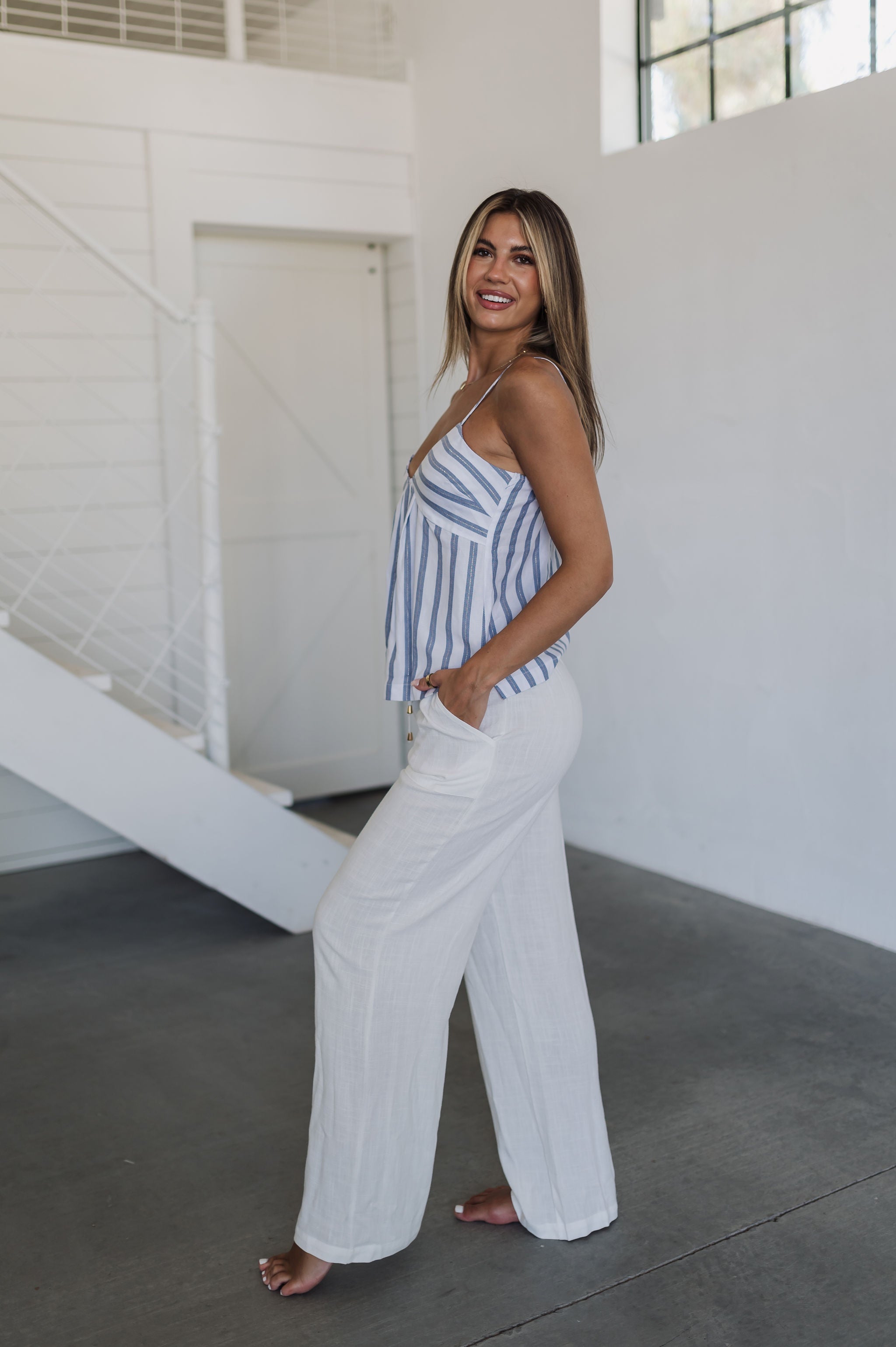 Side view of Nautical Striped Tank Top with V-neck, blue stripes, and spaghetti straps. 