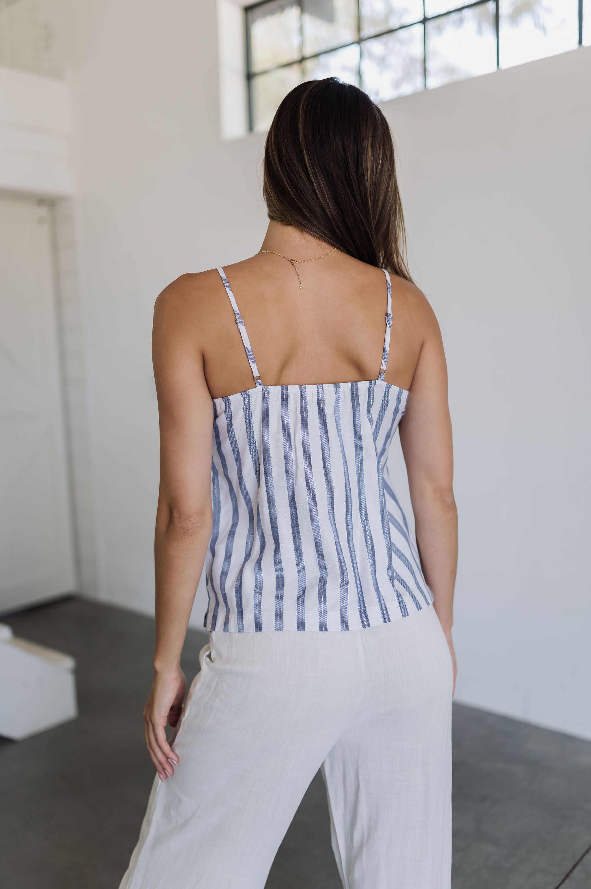 Rear view of Nautical Striped Tank Top with blue stripes and adjustable straps. 