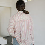 Rear view of Kennedy Striped Button Down Long Sleeve Shirt with fringe hemline.
