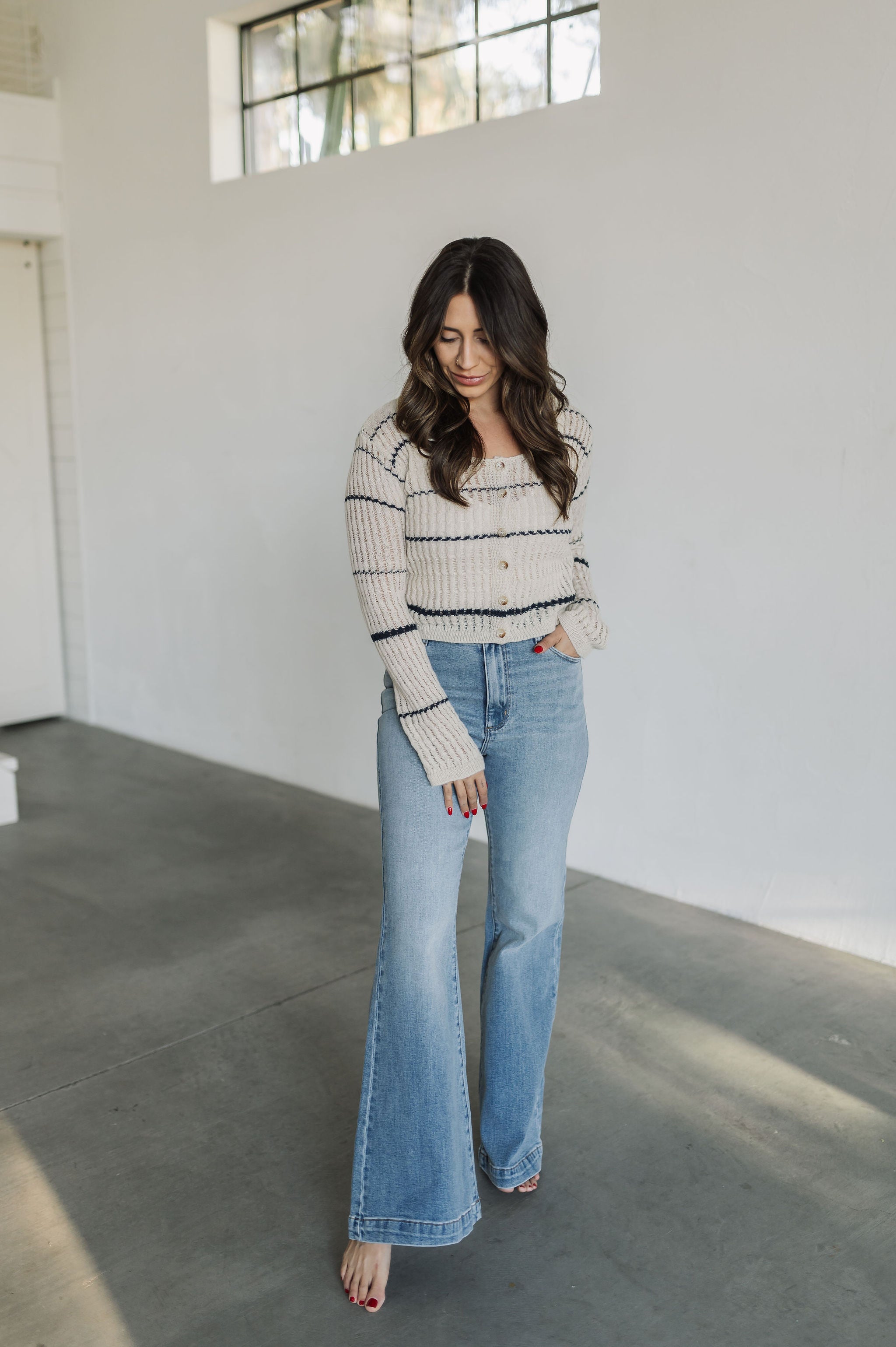 Front view of striped button up Hazel Cardigan.