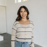 Front view of striped button up Hazel Cardigan with open stitching and scoop neck.