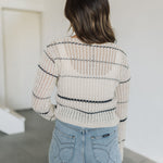 Close up back view of striped Hazel Cardigan with open stitching.