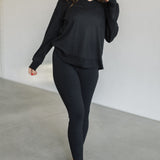 Front view of black Auden V-Neck Long Sleeve Top with waffle-knit design.