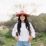 Front view of Astrid sweater with pointelle knit, dolman sleeves, and boat neck. 