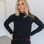 Front view of cropped black  Mock Turtle Neck.