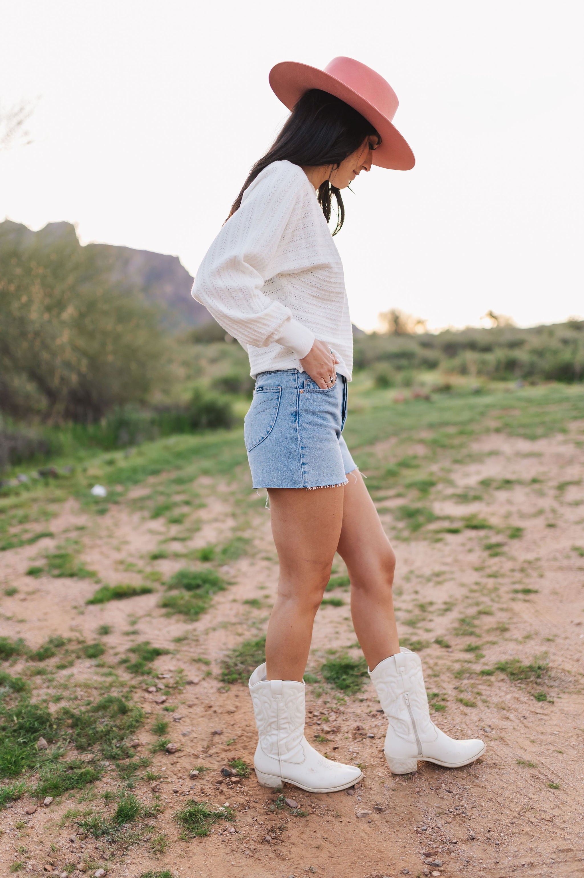 Side view of Astrid sweater with pointelle knit, dolman sleeves, and boat neck. 