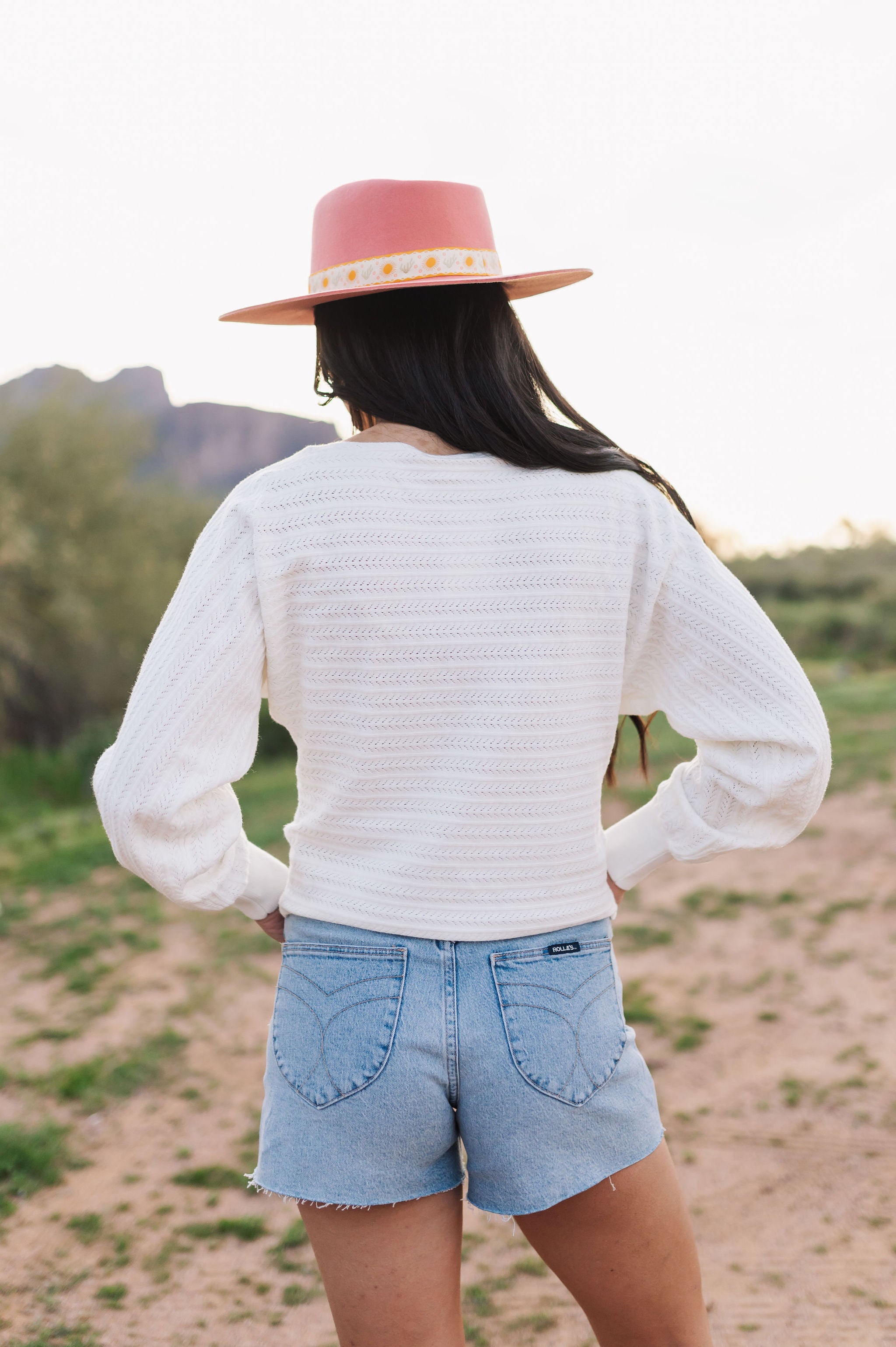 Rear view of Astrid sweater with pointelle knit, dolman sleeves, and boat neck. 