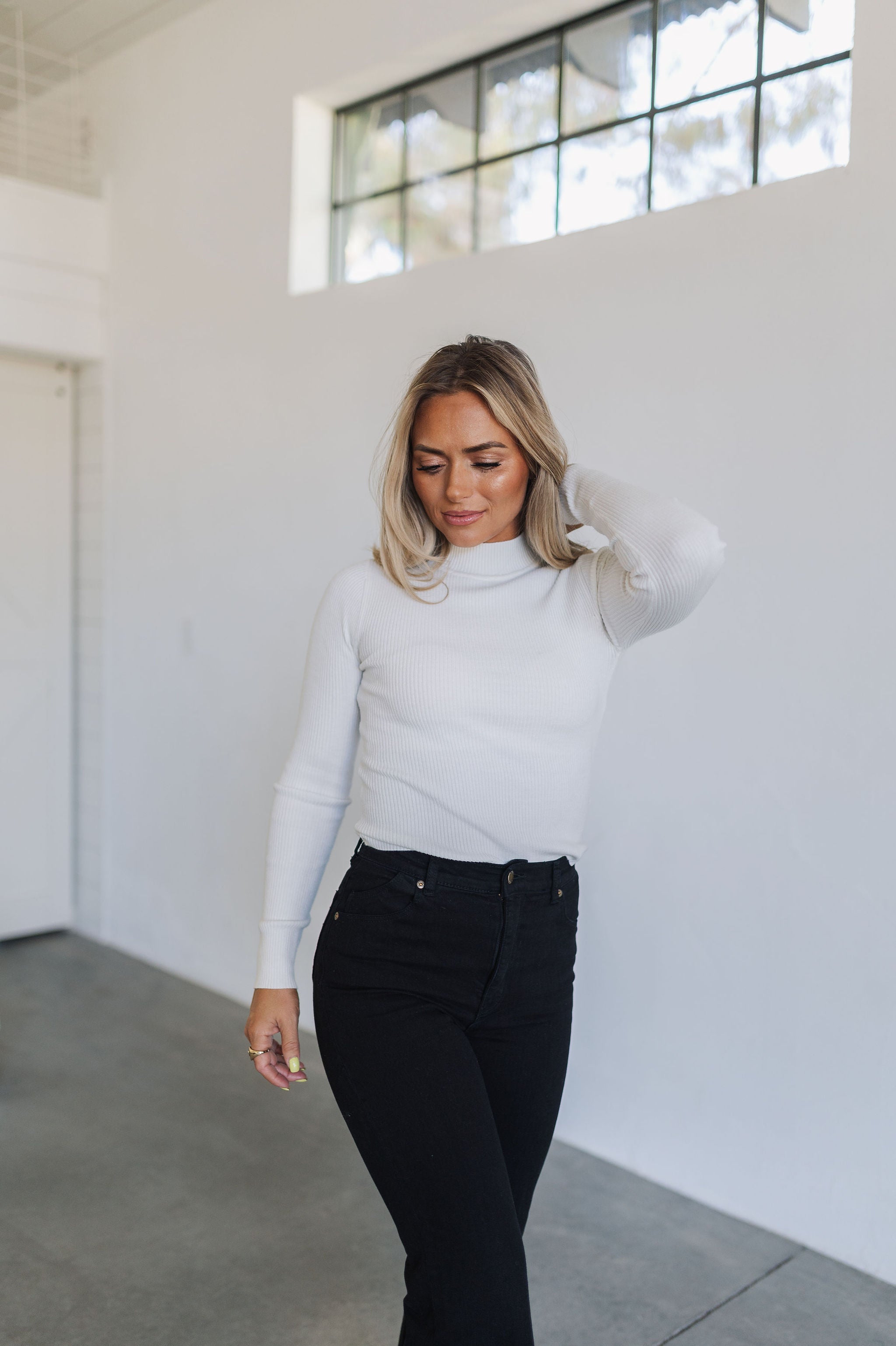 Front view of cropped white Mock Turtle Neck.