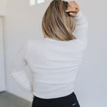Rear view of cropped white Mock Turtle Neck.