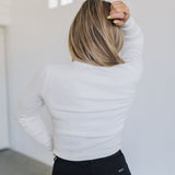 Rear view of cropped white Mock Turtle Neck.