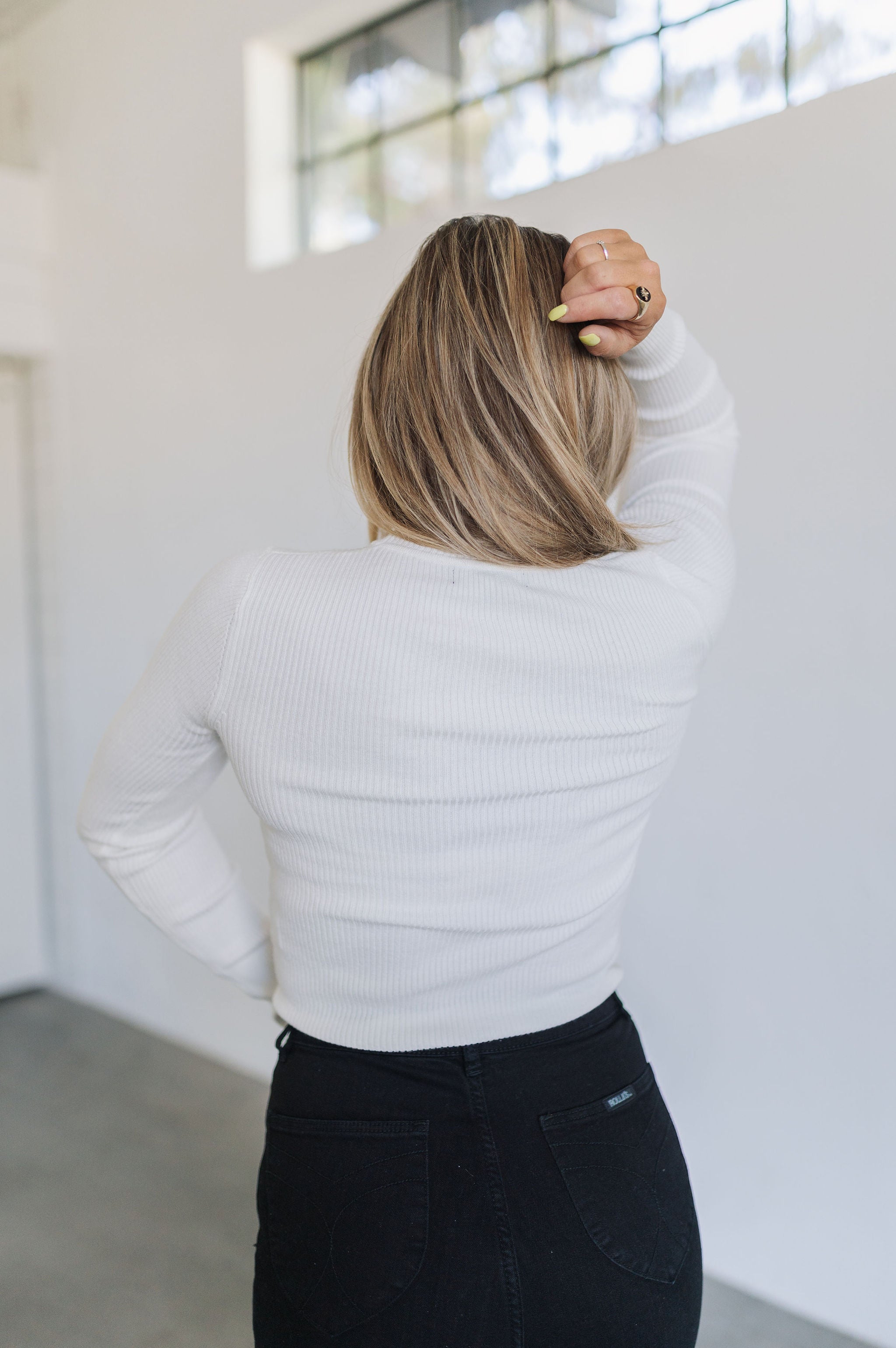 Rear view of cropped white Mock Turtle Neck.