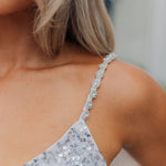 Close up view of Sparks Fly Mini Dress thin straps with sequin detailing. 