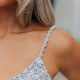 Close up view of Sparks Fly Mini Dress thin straps with sequin detailing. 
