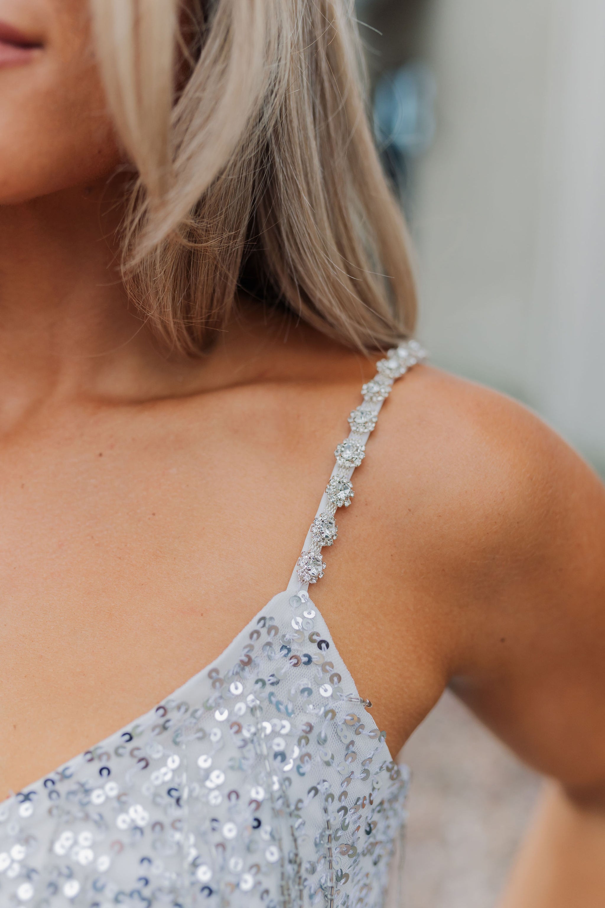 Close up view of Sparks Fly Mini Dress thin straps with sequin detailing. 