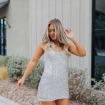 Front view of Sparks Fly Mini Dress with thin straps and allover fringe and sequin details. 