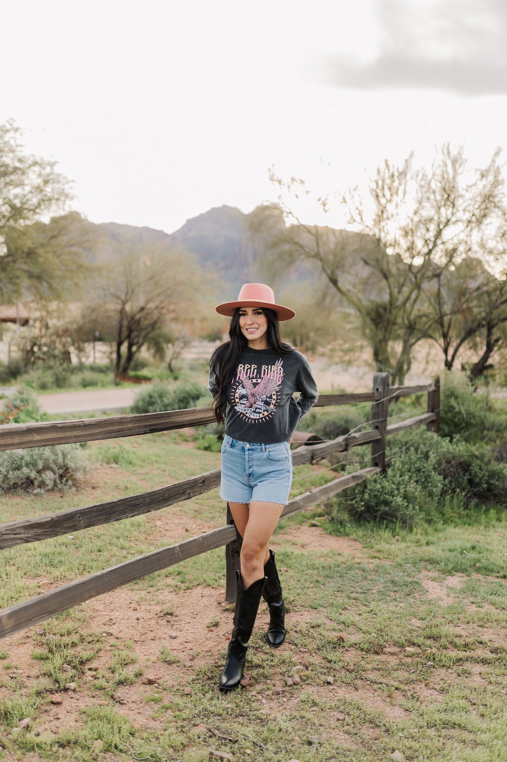 Front view of cropped Freebird Long Sleeve Graphic Tee with distressed graphic and raw hem. 