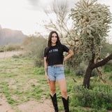 Front view of Hey Y'all Graphic Tee in mineral wash, distressed graphic, and raw hem. 