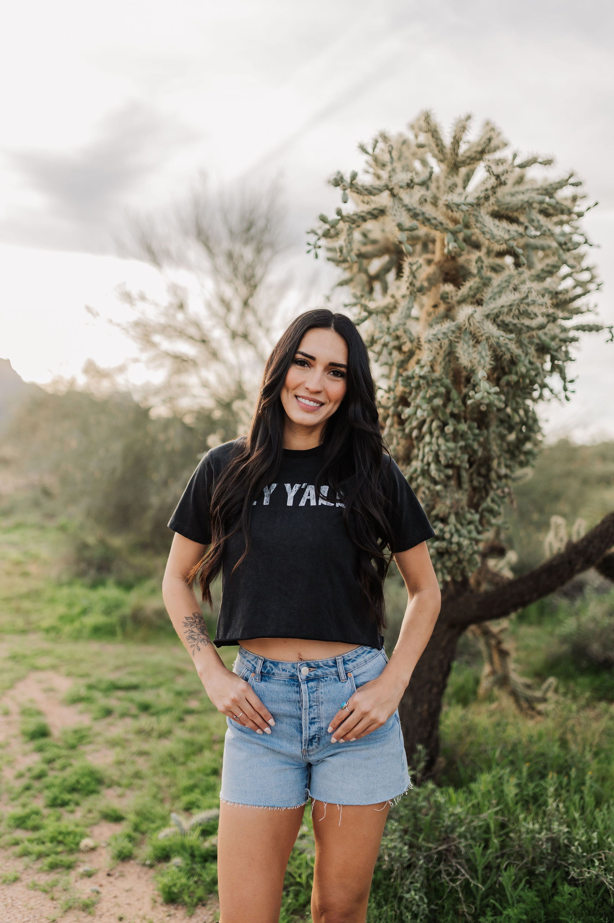 Front view of Hey Y'all Graphic Tee in mineral wash, distressed graphic, and raw hem. 