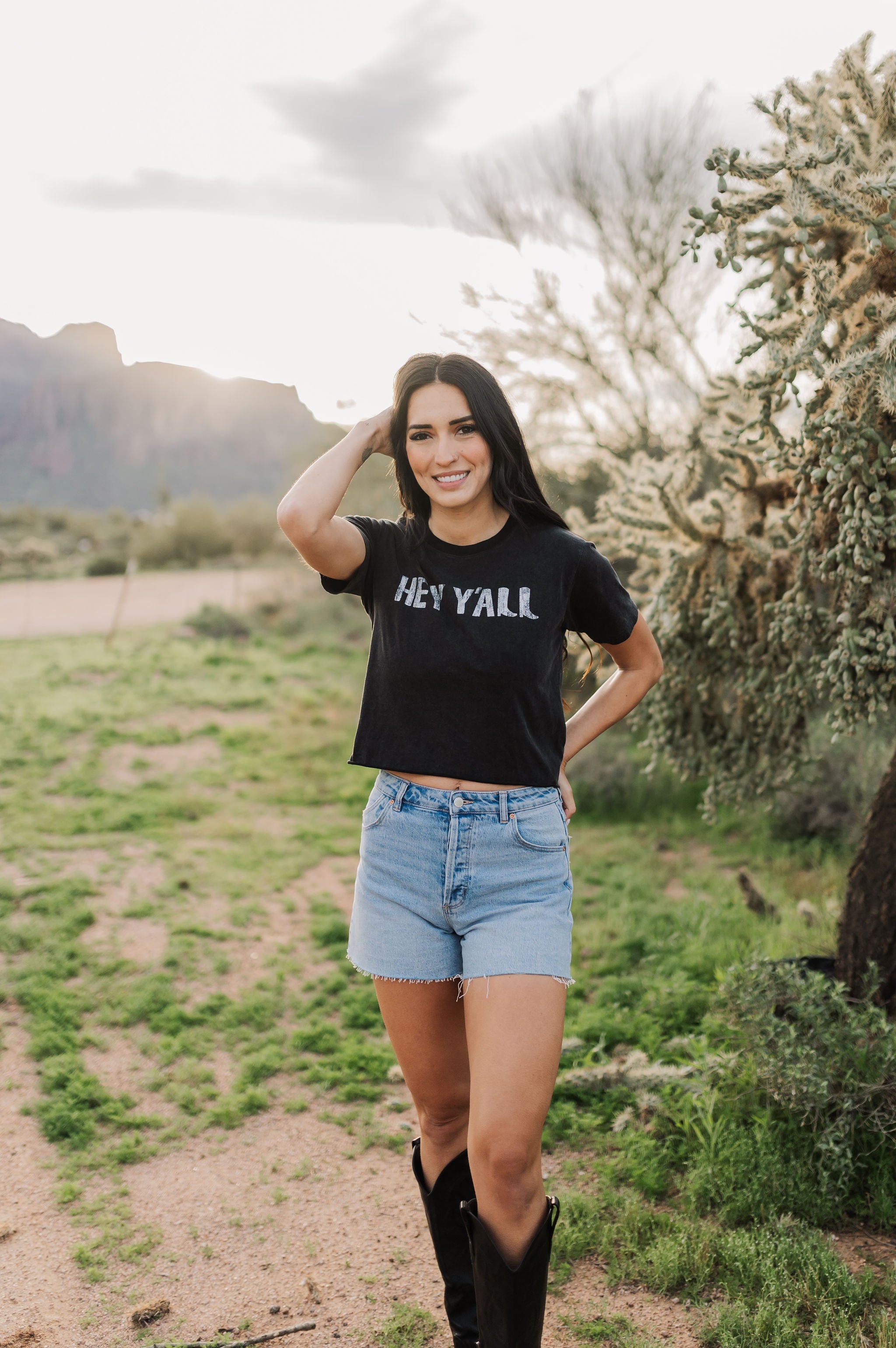 Front view of Hey Y'all Graphic Tee in mineral wash, distressed graphic, and raw hem. 