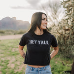 Front view of Hey Y'all Graphic Tee in mineral wash, distressed graphic, and raw hem. 