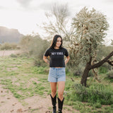 Front view of Hey Y'all Graphic Tee in mineral wash, distressed graphic, and raw hem. 