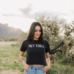 Front view of Hey Y'all Graphic Tee in mineral wash, distressed graphic, and raw hem. 