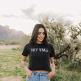 Front view of Hey Y'all Graphic Tee in mineral wash, distressed graphic, and raw hem. 