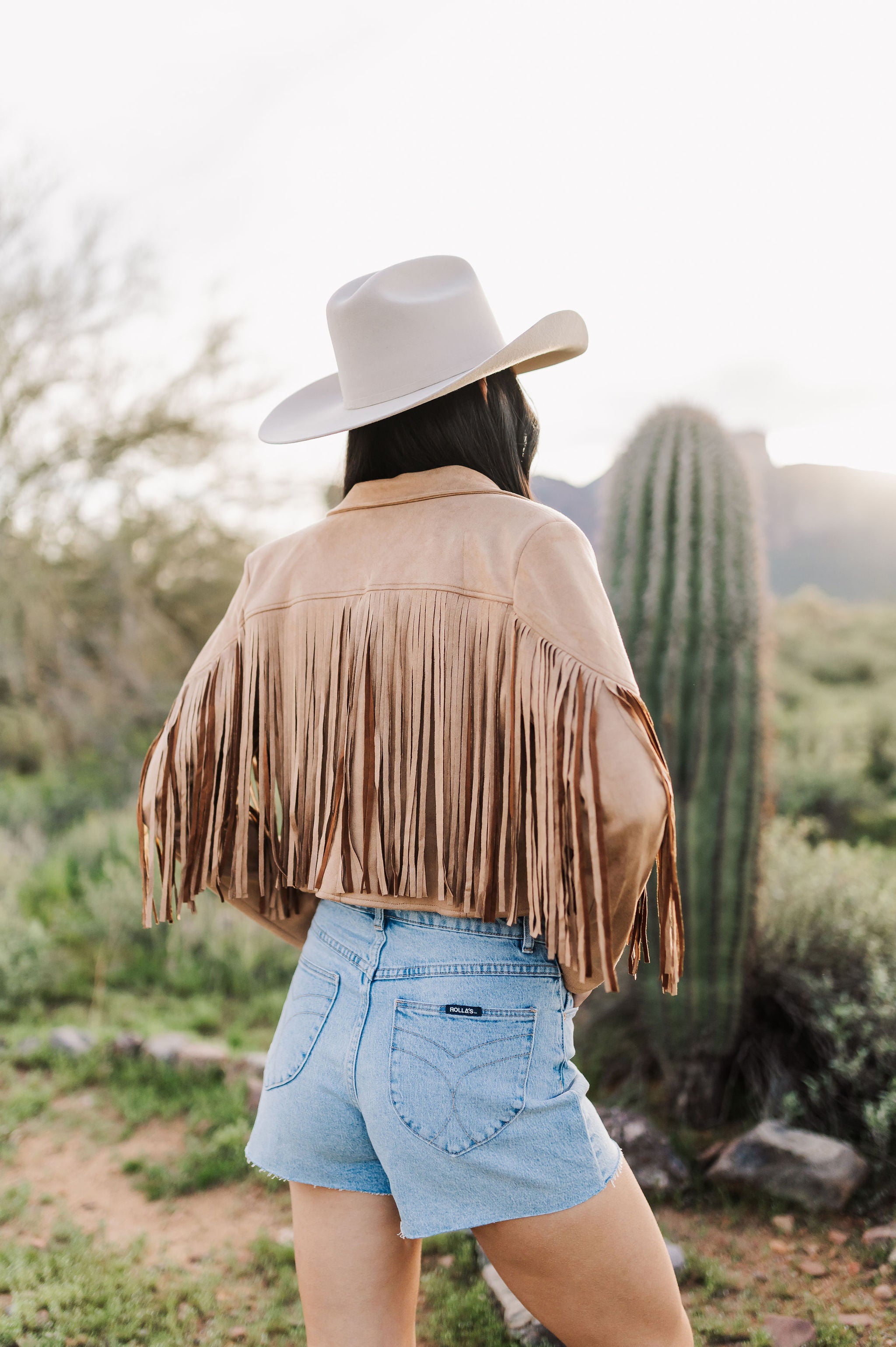 Rear view of cropped Cooper Fringed Suede Jacket with tassels. 