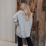 Rear view of Classic Crewneck in silver metallic with dropped shoulders and oversized length.